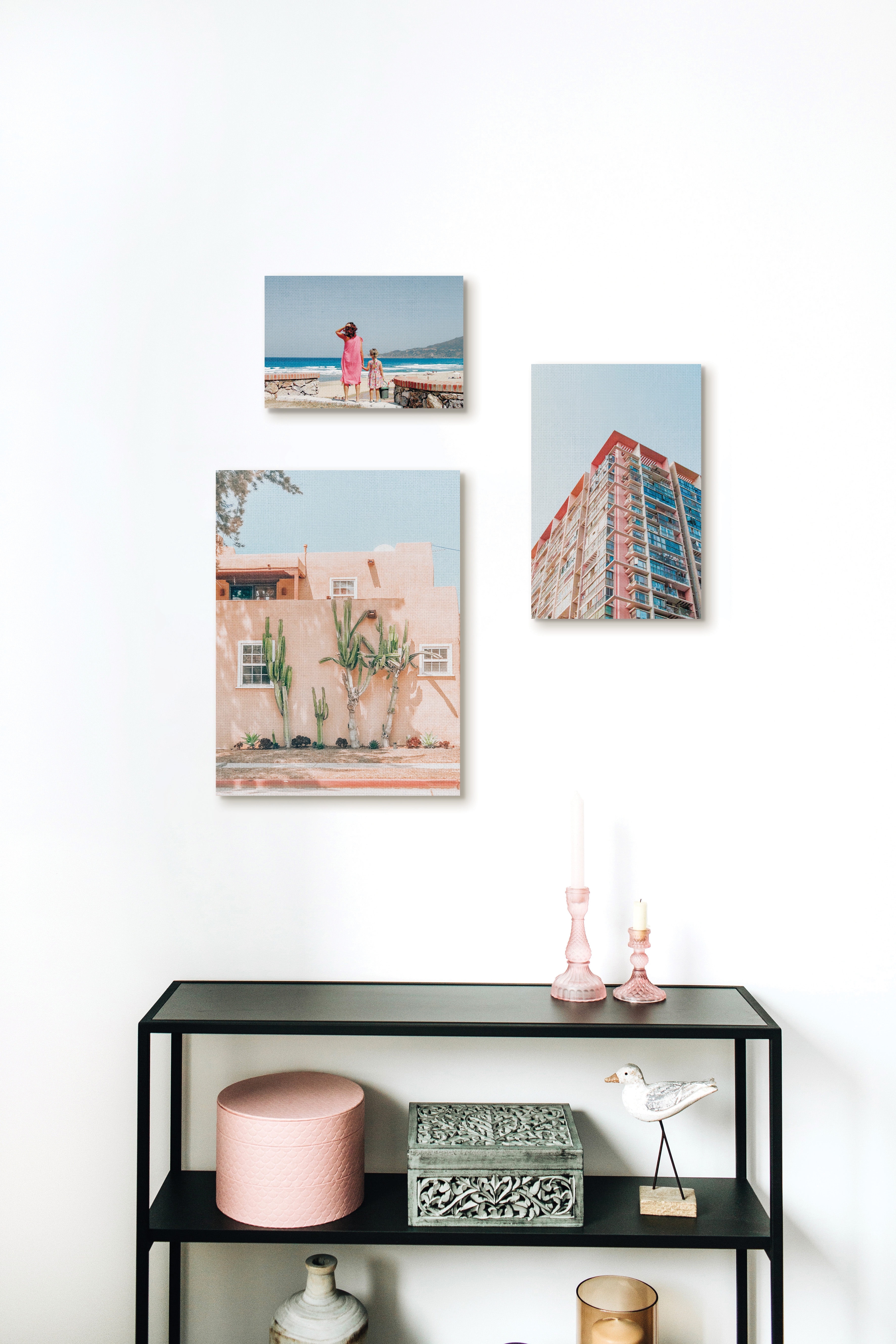 Gallery wall of canvas prints above table