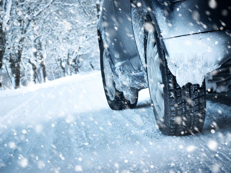 driving-in-blizzard-tire-close-up-in-snow.jpg
