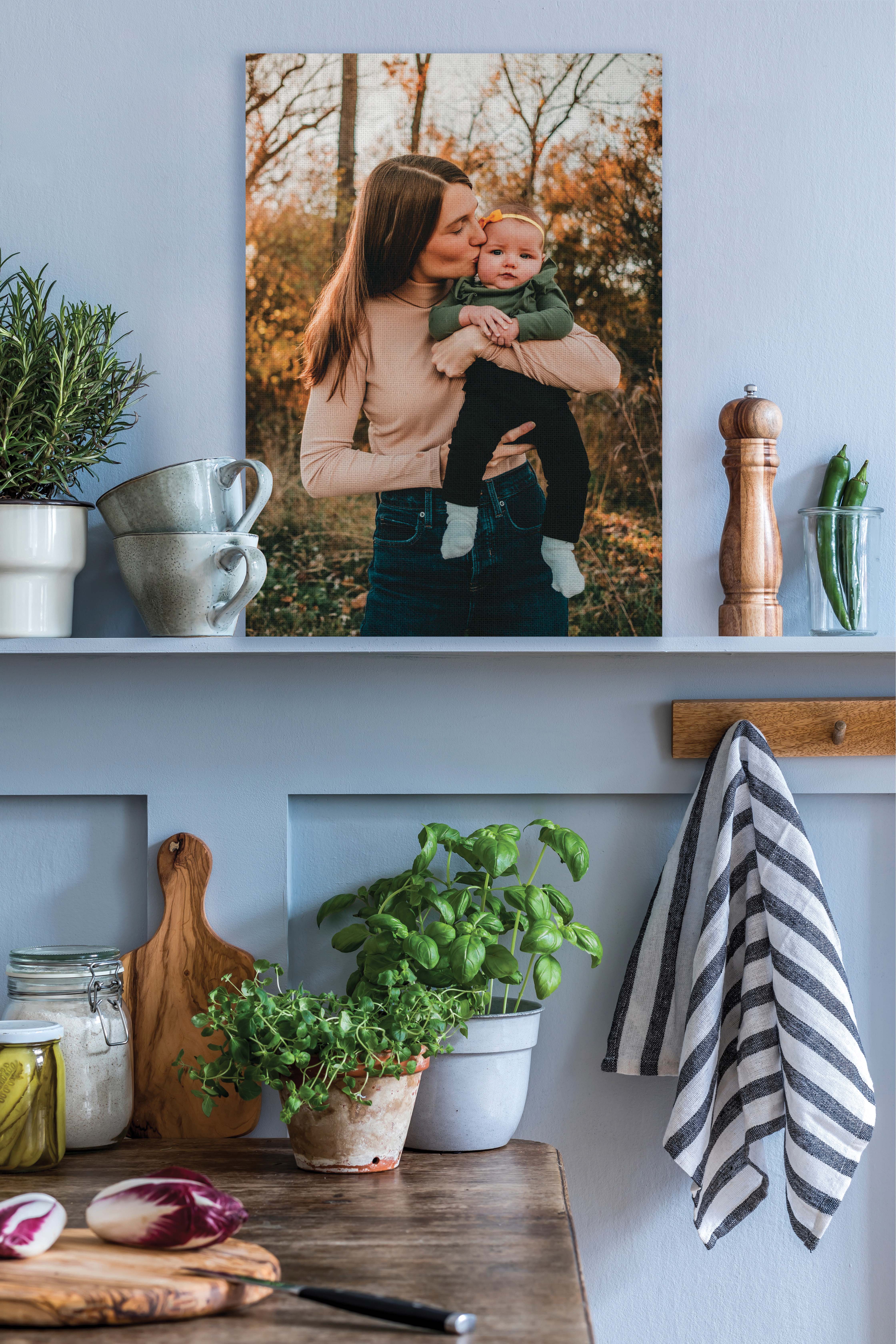 Canvas print of mother and daughter on shelf in kitchen