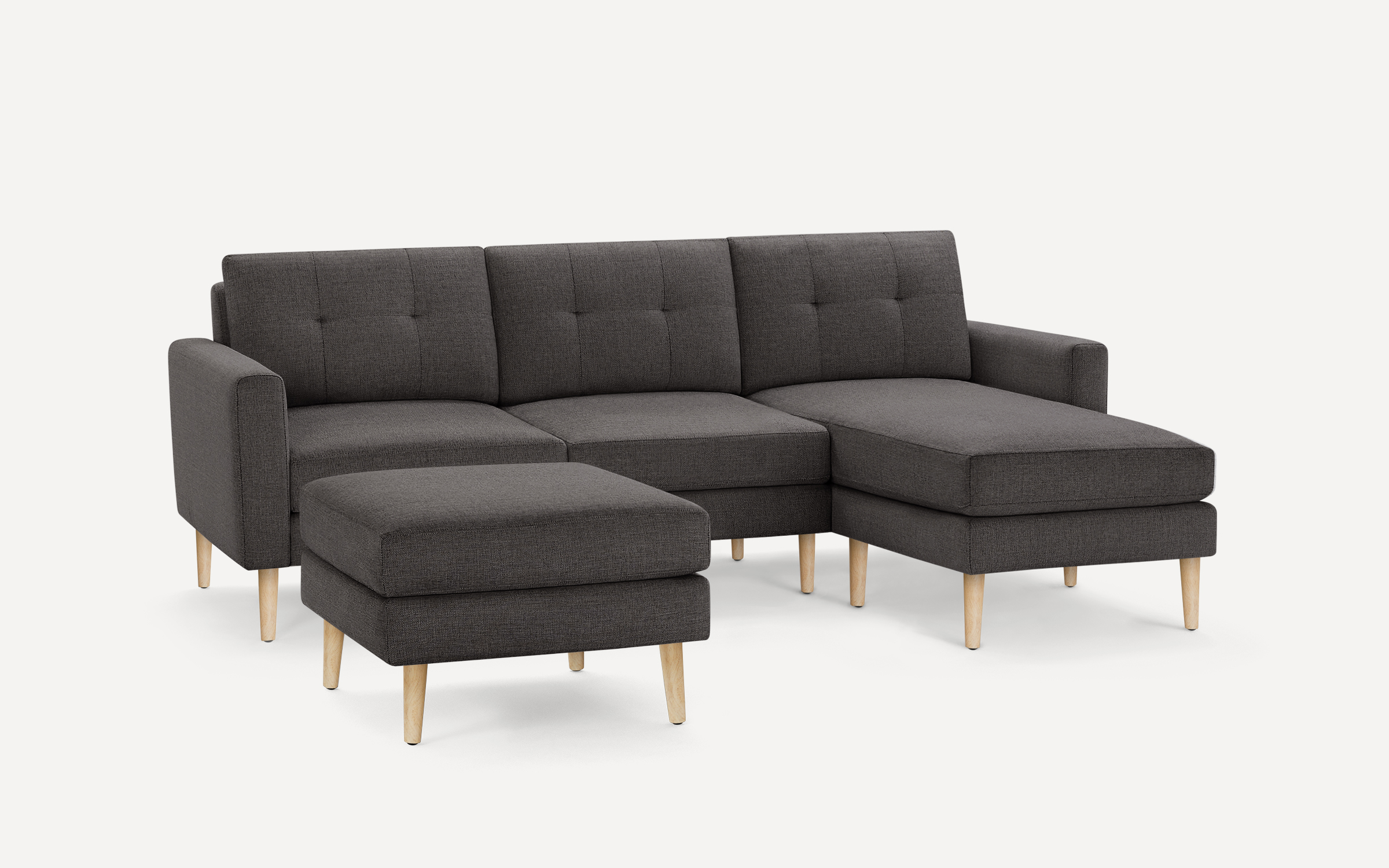 The Nomad Fabric Sectional Sofa with Ottoman Burrow