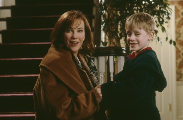 Photo of young boy and mother from Home Alone smiling