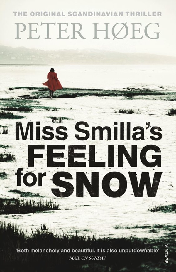 Book cover for Miss Smilla's Feeling for Snow: A woman in a red coat walking away on snow covered ground.