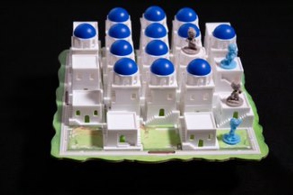 Photo of the Santorini game board in play.