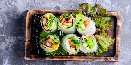A tray of vegetable spring rolls as wedding appetizers. Photo credit Canva
