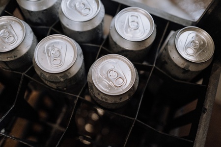 A crate of beer cans, a BYOB catering hack