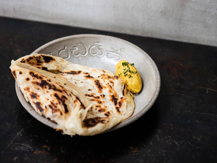 Hand-stretched paratha roti, coconut and lovage butter
