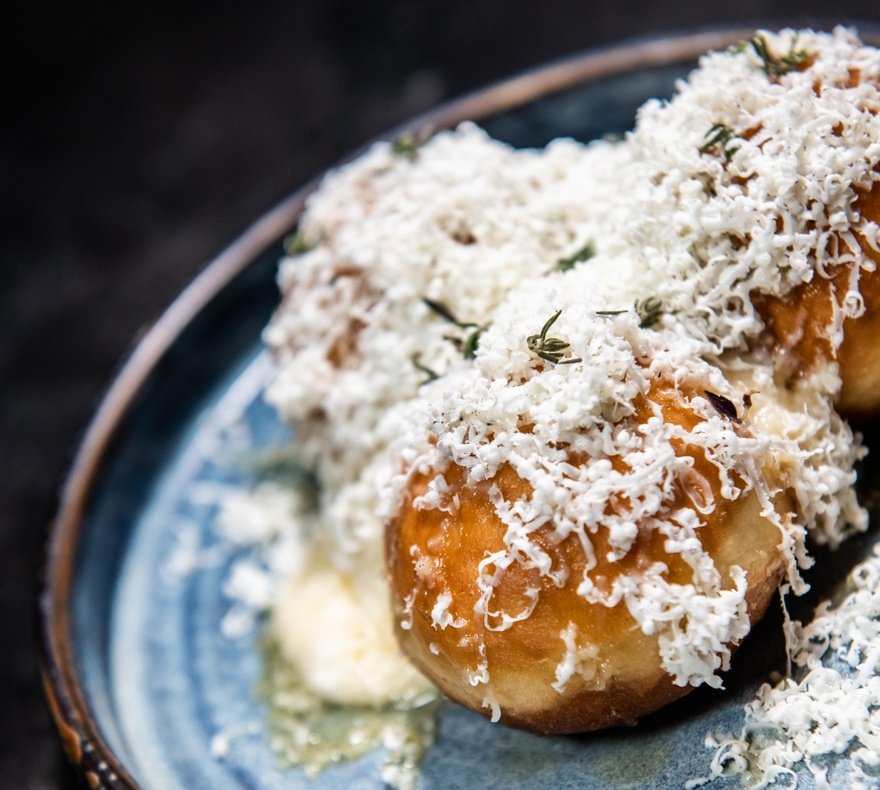 Whipped goats' cheese, blossom honey and thyme doughnuts