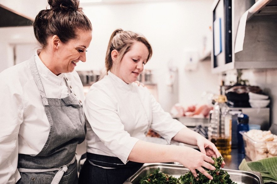 A unique aspect of Wilson Vale is that all of their area managers are trained chefs like Emma Powell seen here training a member of the team )