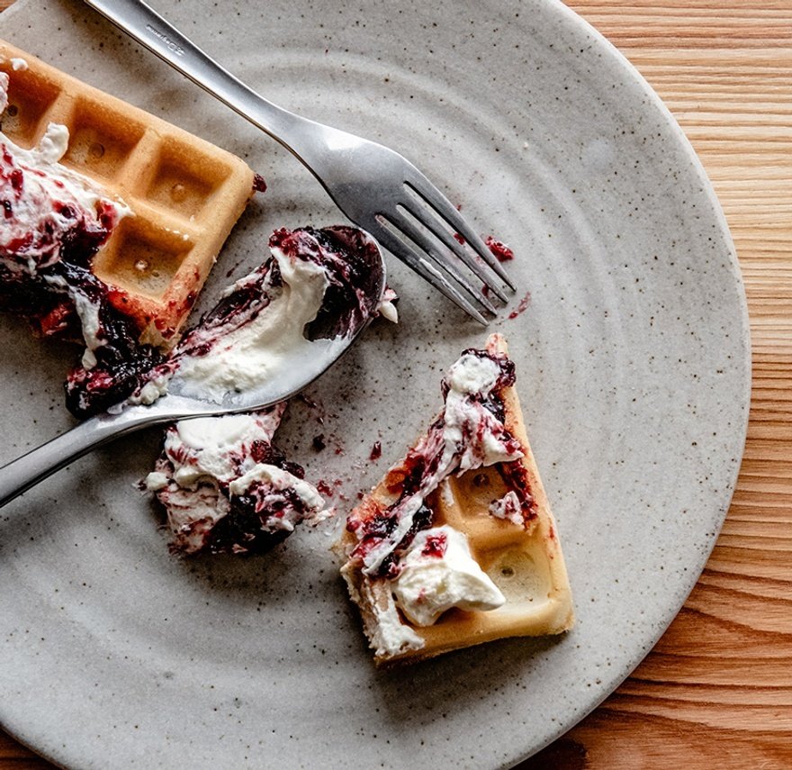 Waffles with fruit compote and woodruff cream