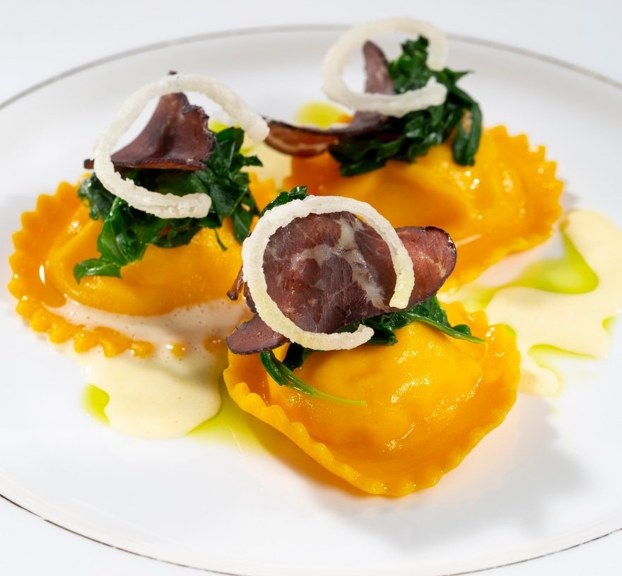 Smoked Gubbeen ravioli, ‘our' bresaola, Russian kale, butter sauce