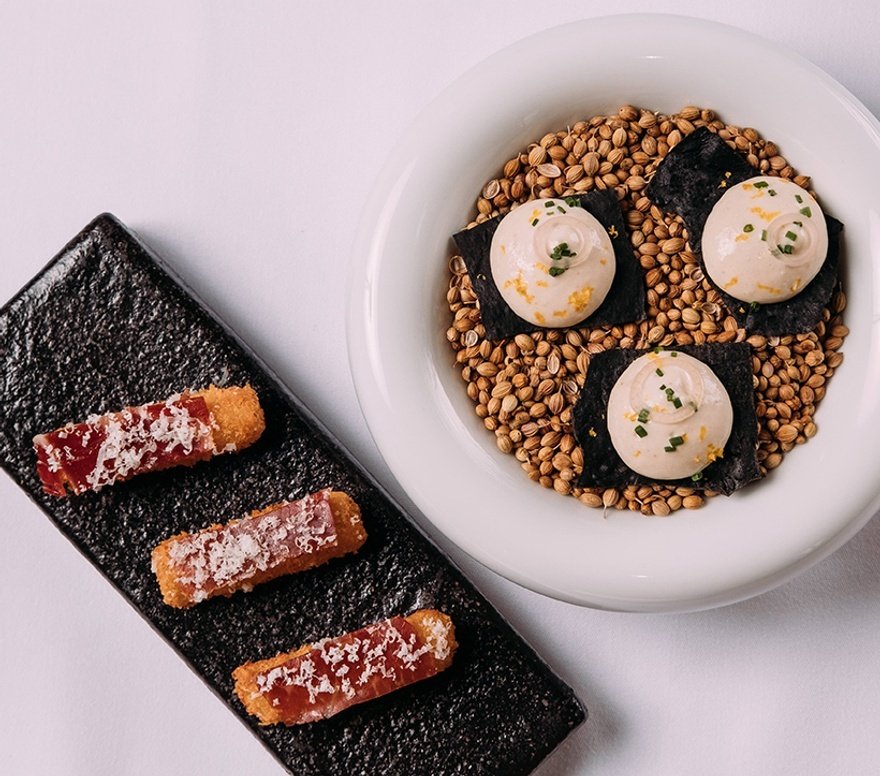 Croquettes with pata negra, and squid ink lavosh cracker with taramasalata foam