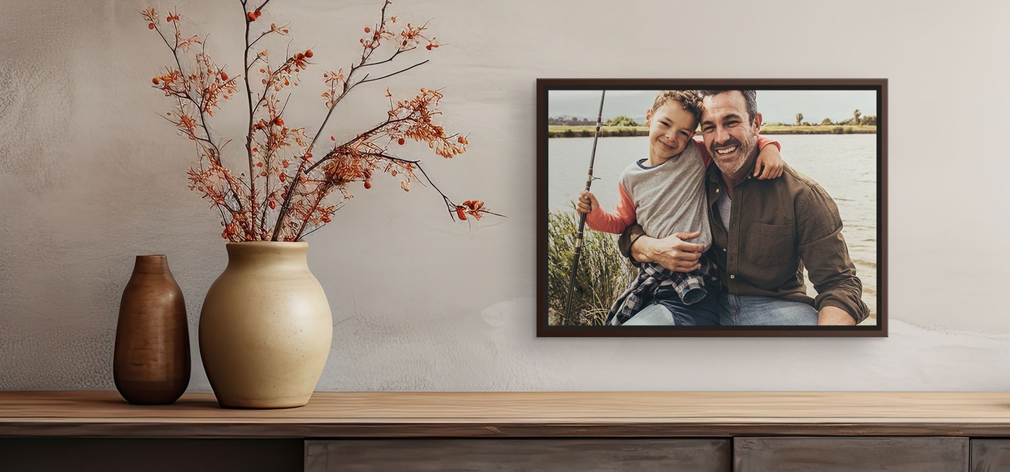 A framed canvas print showcasing a photo of a father and son fishing together