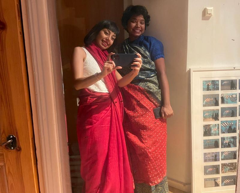 Elham (left) and Vidha (right), wearing sarees and celebrating Shahrukh Khan’s birthday